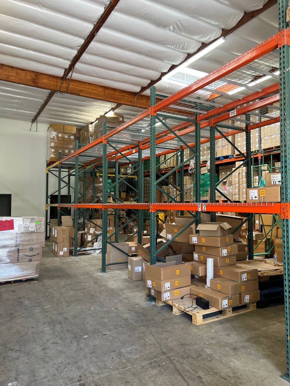 Warehouse aisle with cartons arranged on pallet racking